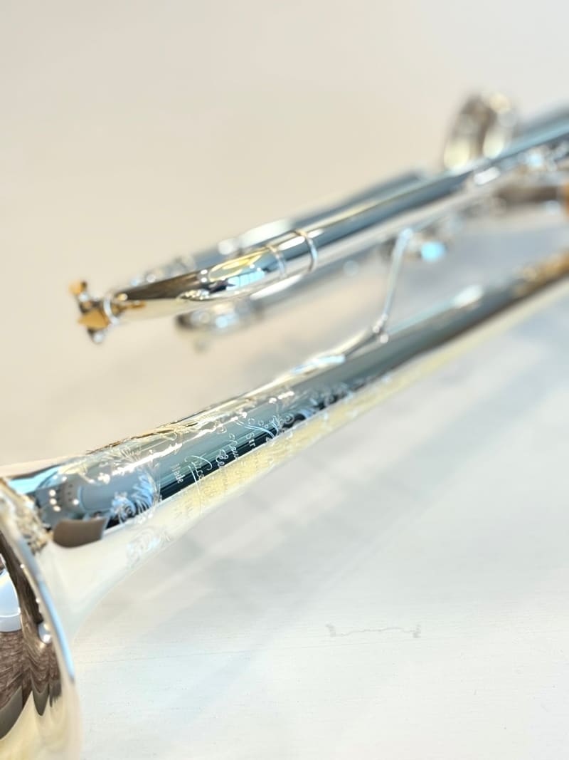 Engraving detail on the silver-plated bell of the Bach Centennial Bb trumpet