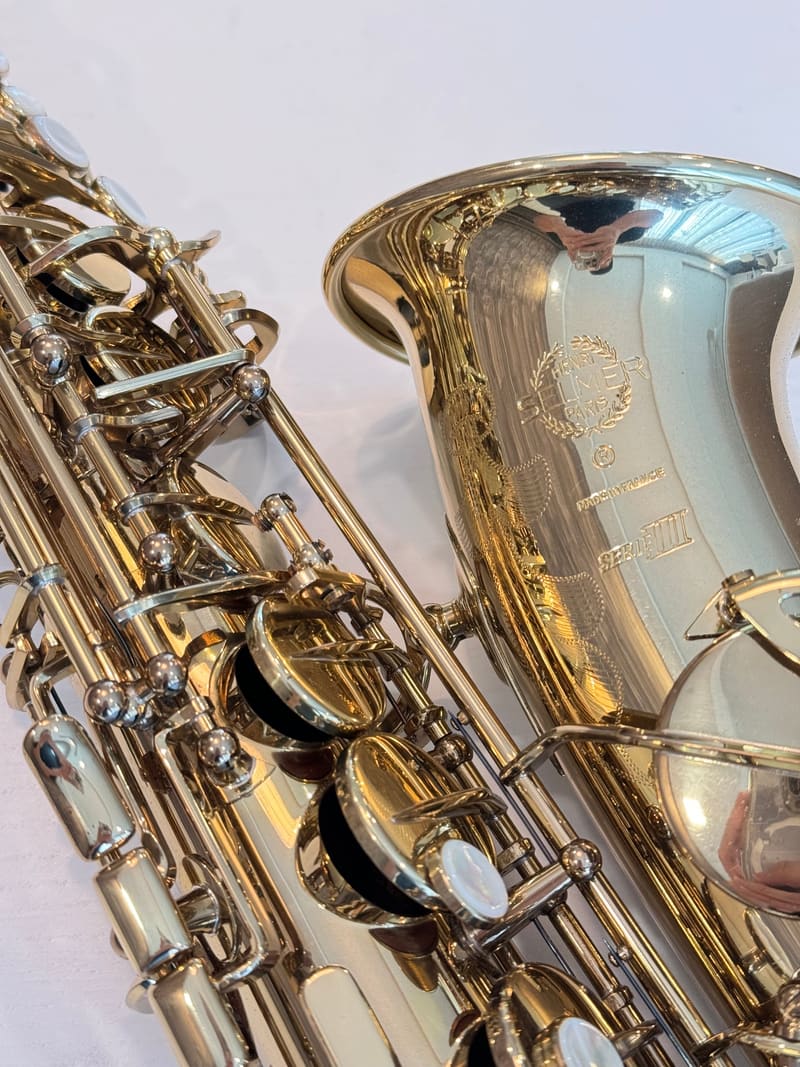 Engraved bell of a Selmer Paris Series III alto saxophone